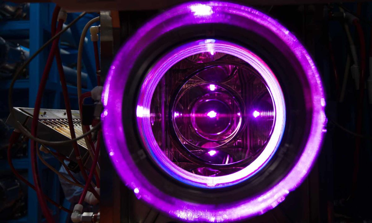 rings of purple with a box with wires in the left side background