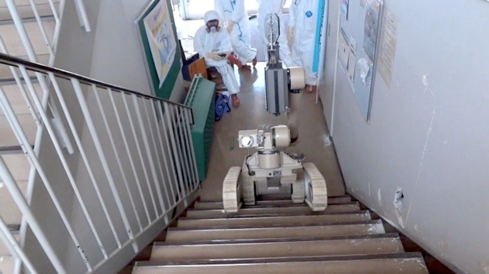 robot operator driving irobot warrior climbing stairs at fukushima daiichi nuclear power plant