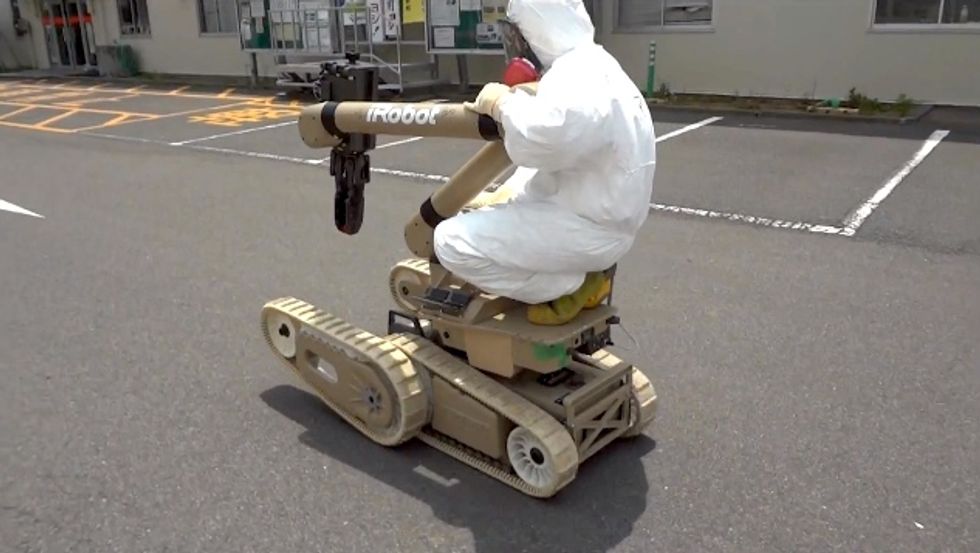 robot operator riding irobot warrior at fukushima daiichi nuclear power plant