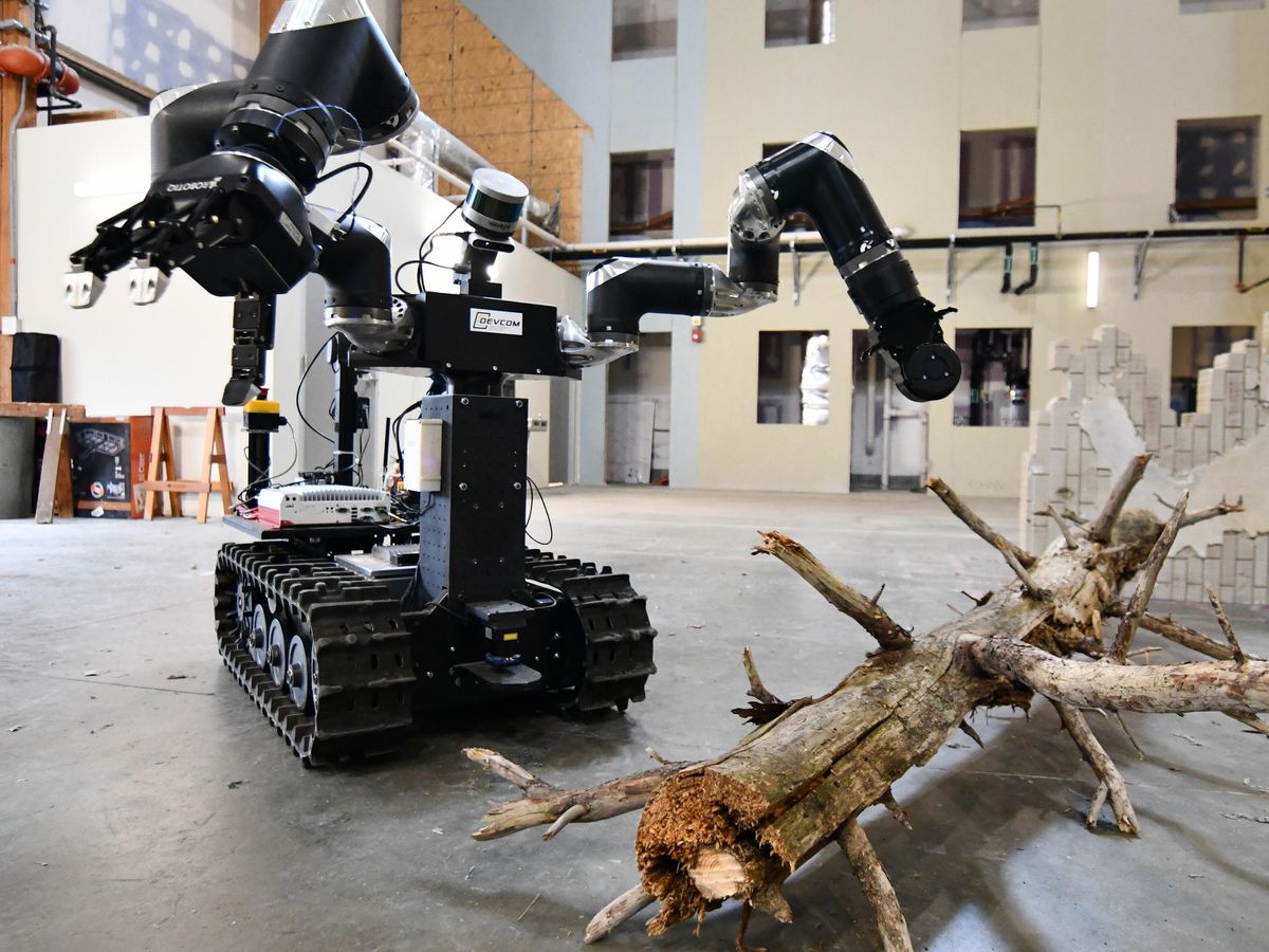 Robot with threads near a fallen branch