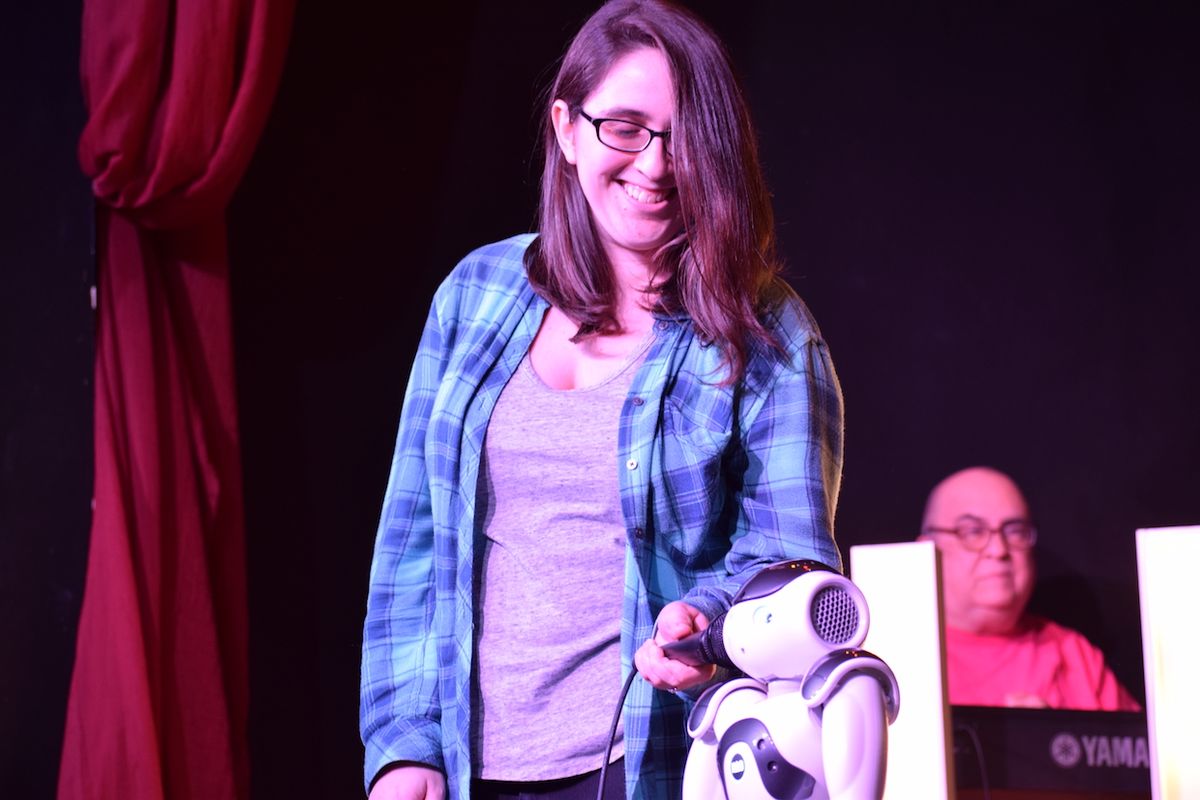 Roboticist and comedian Naomi Fitter with her Nao robot during a stand-up performance
