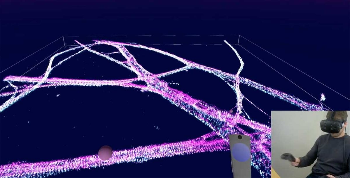 Screenshot from a video of a researchers using LumeVR's software to fly through the spectrin rings of a neuron.