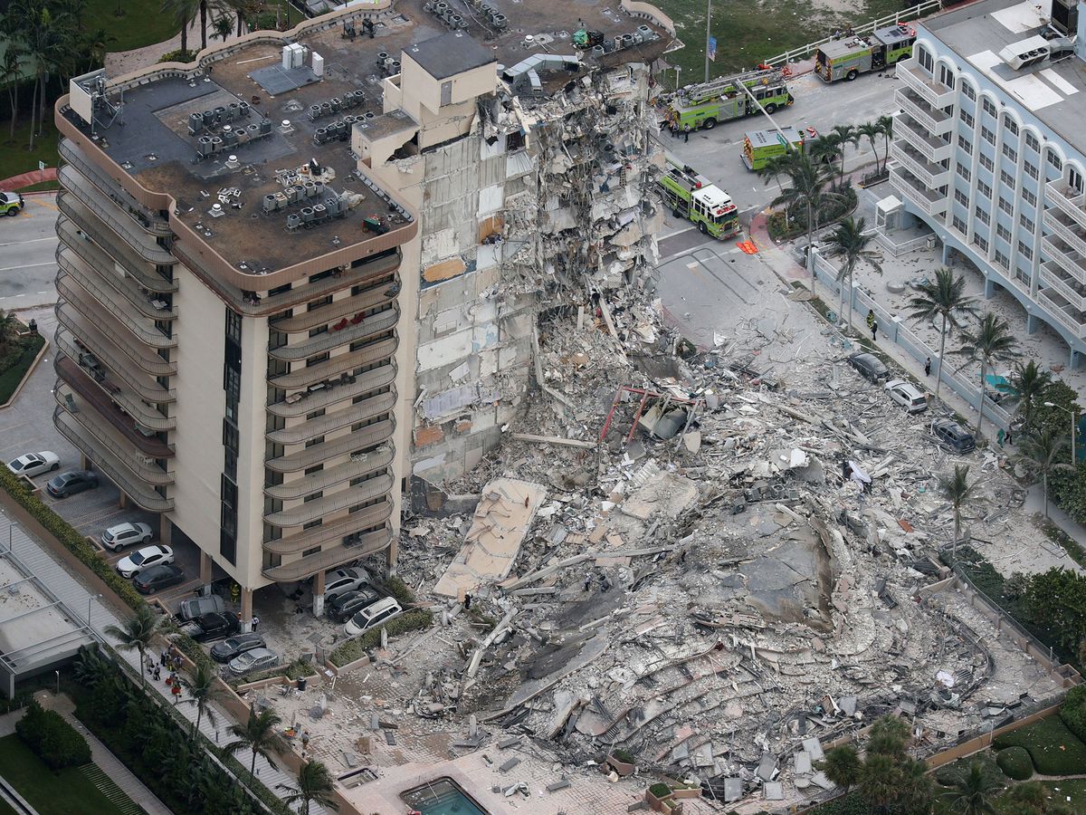 Search and rescue personnel work in the rubble of the 12-story condo tower that crumbled to the ground during a partially collapse of the building on June 24, 2021 in Surfside, Florida.