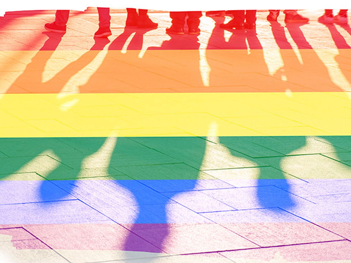 Shadows of people standing in line overlayed with a rainbow.
