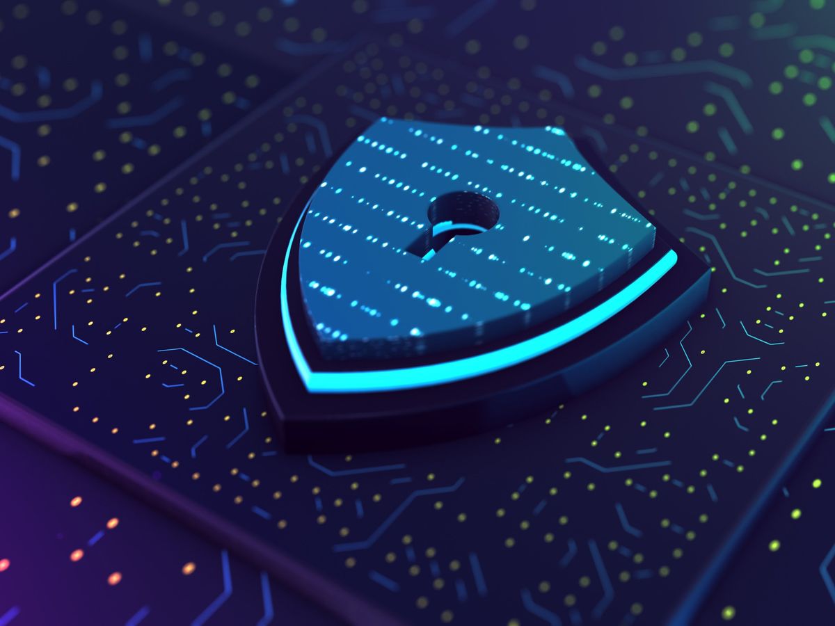 shield with a keyhole in middle sitting on top of a computer board