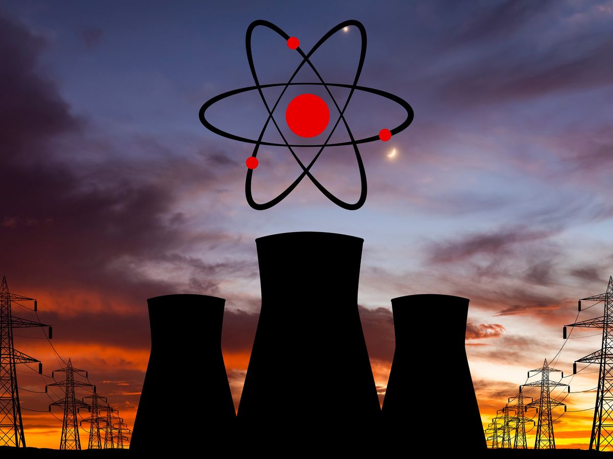 silhouette of 3 nuclear reactor cylinders against a sunset with a nuclear reaction above the reactors