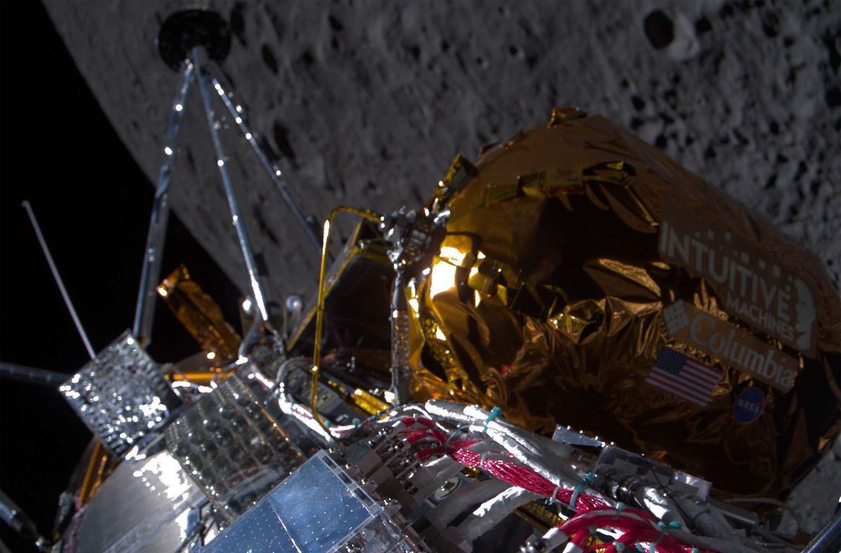 spaceship in foreground with nearby lunar surface in background
