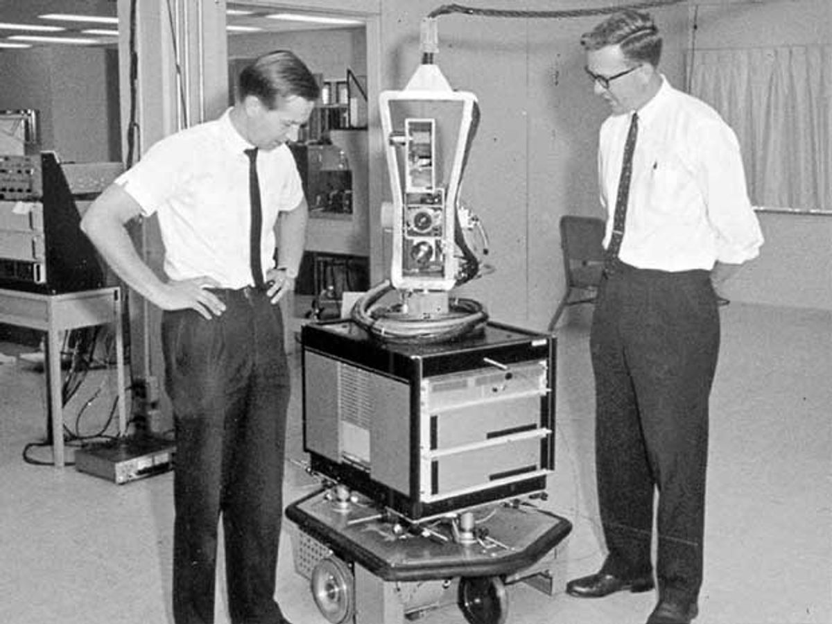 SRI researchers Nils Nilsson (right) and Sven Wahlstrom with Shakey the Robot in the late 1960s.