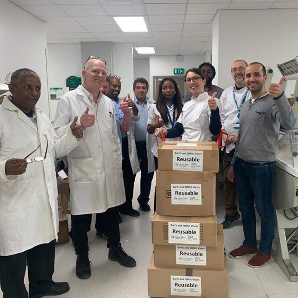 Staff receiving a delivery of personal protection equipment at Barts Health NHS Trust, Queen Mary University of London's hospital.