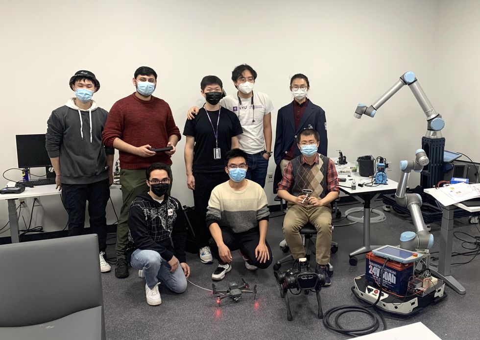 Student researchers in the robotics laboratory of Chen Feng, with machine learning systems designed to enhance robotic perceptual functions