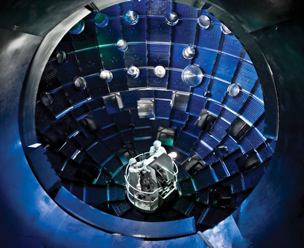 Technicians work inside the target chamber of the National Ignition Facility