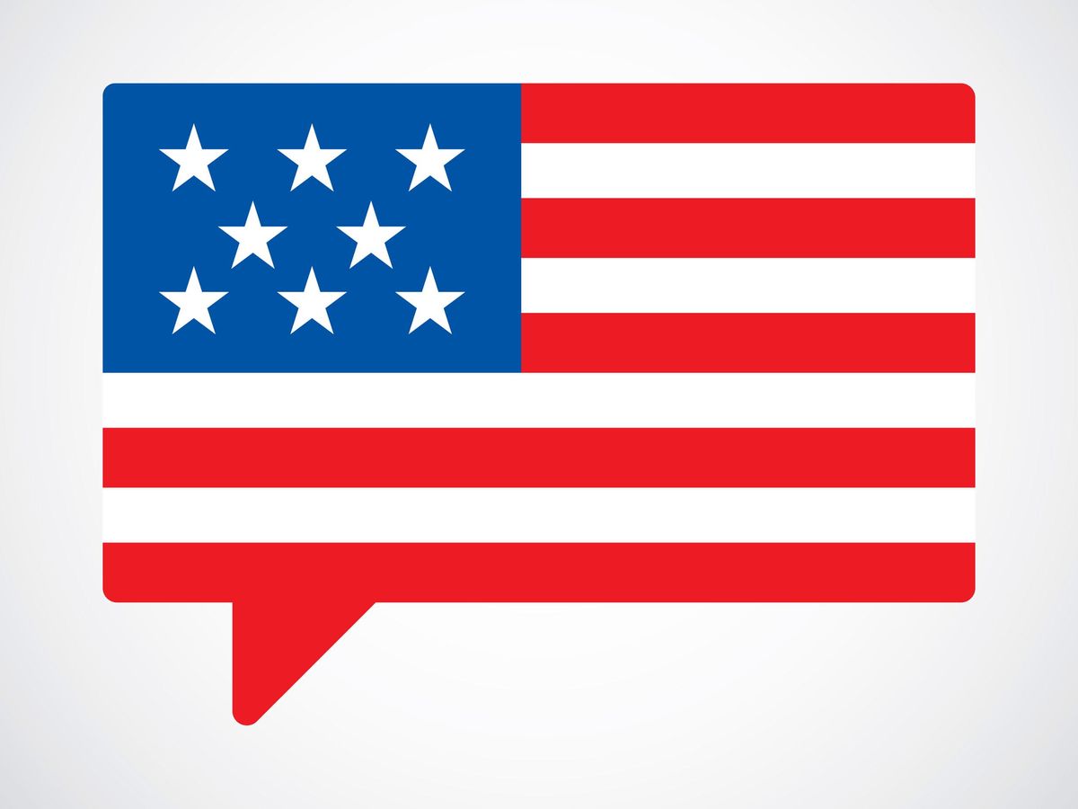text bubble with American flag against a white background