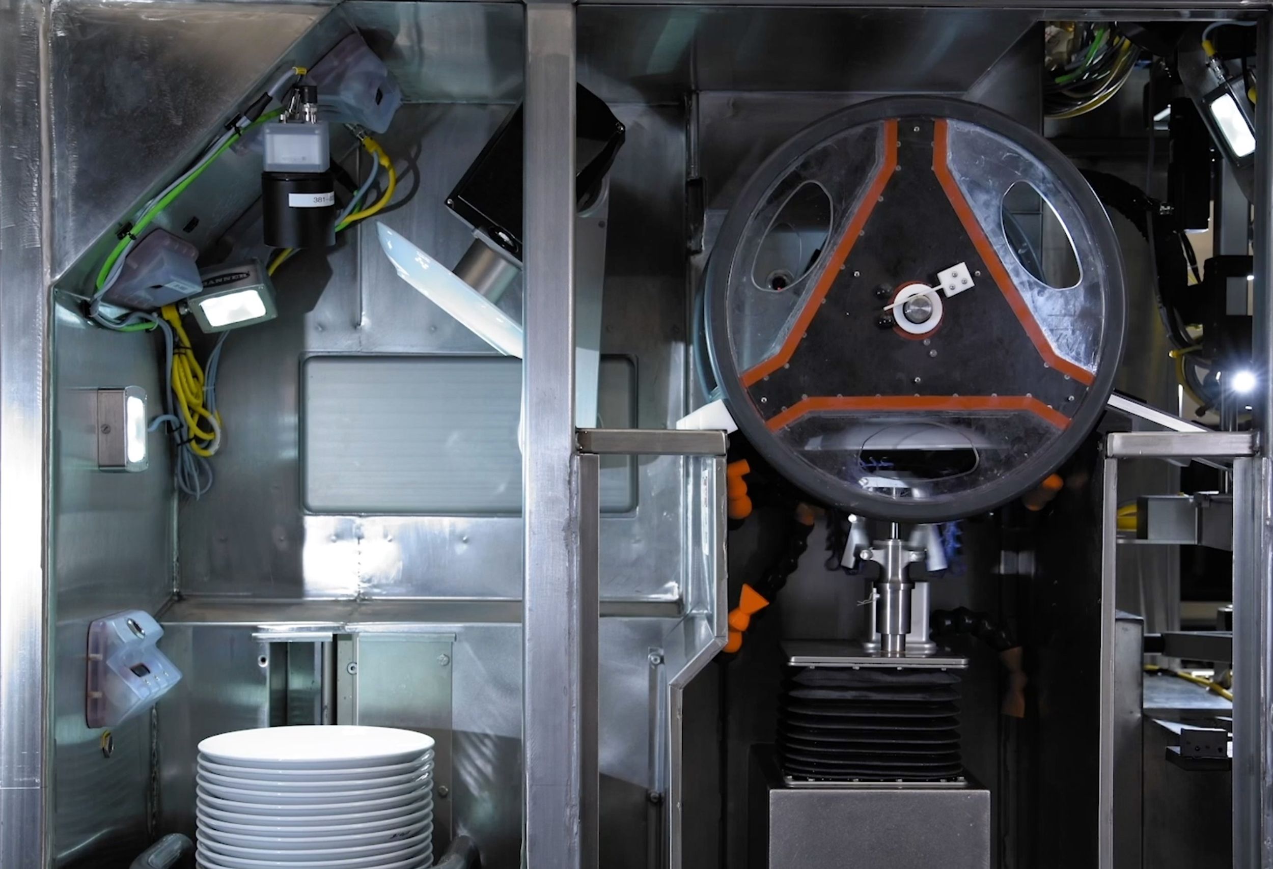 The Dishcraft Robotics dish washing robot system uses a robotic arm and AI