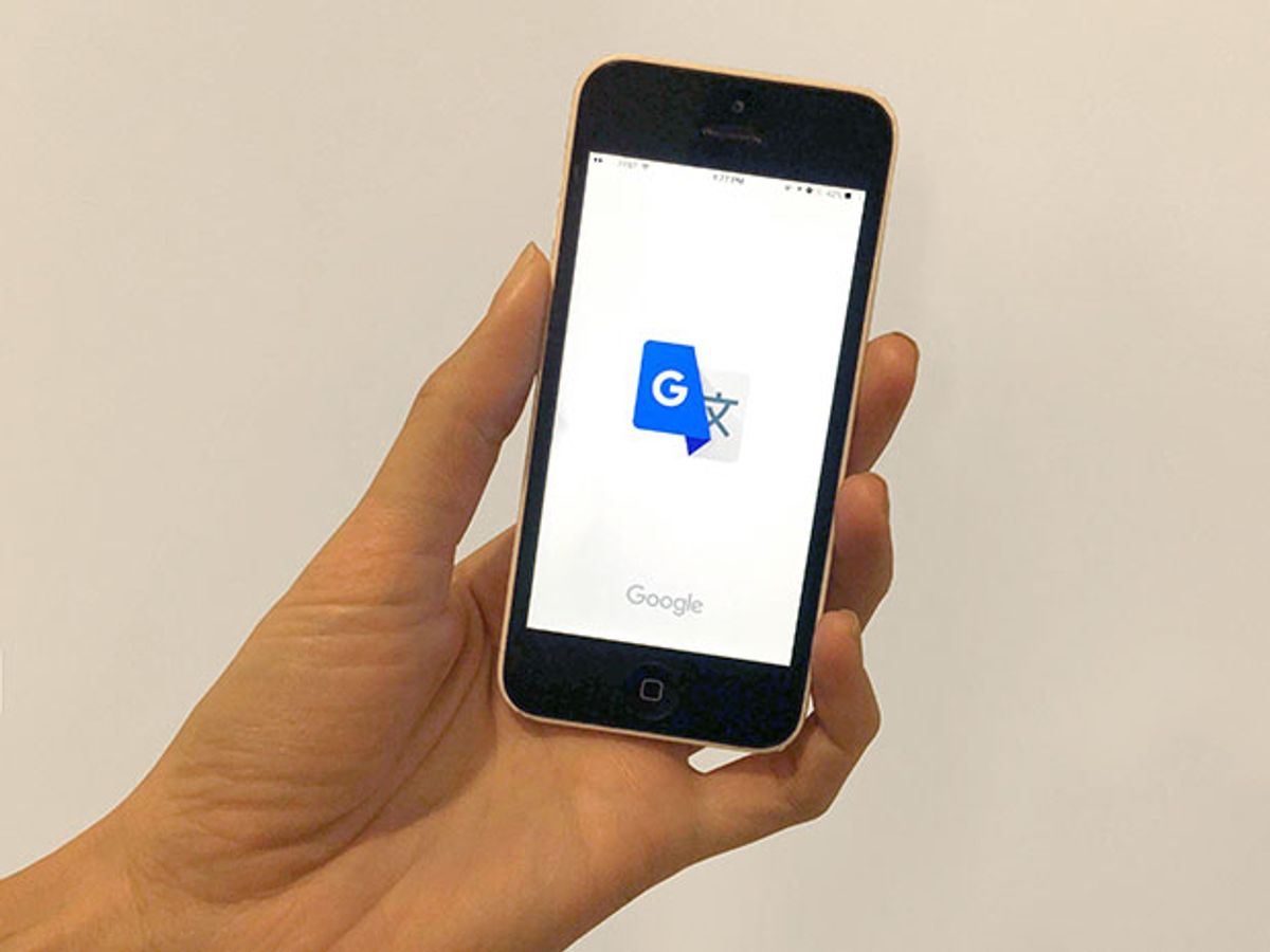 The Google Translate icon on the screen of a smartphone