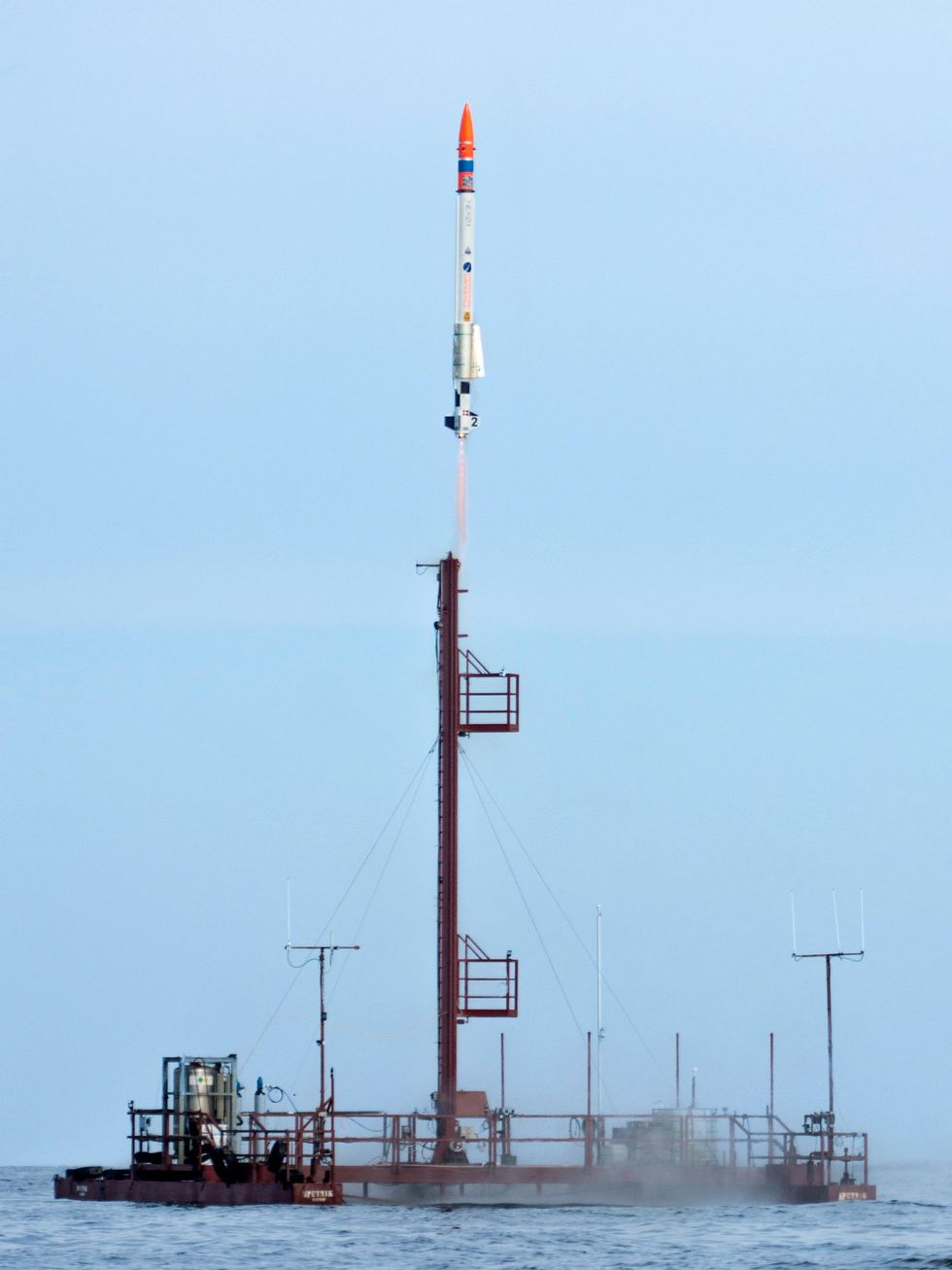 The left photo shows a launch platform floating in the water, and a rocket ascending from the launch tower into the sky.