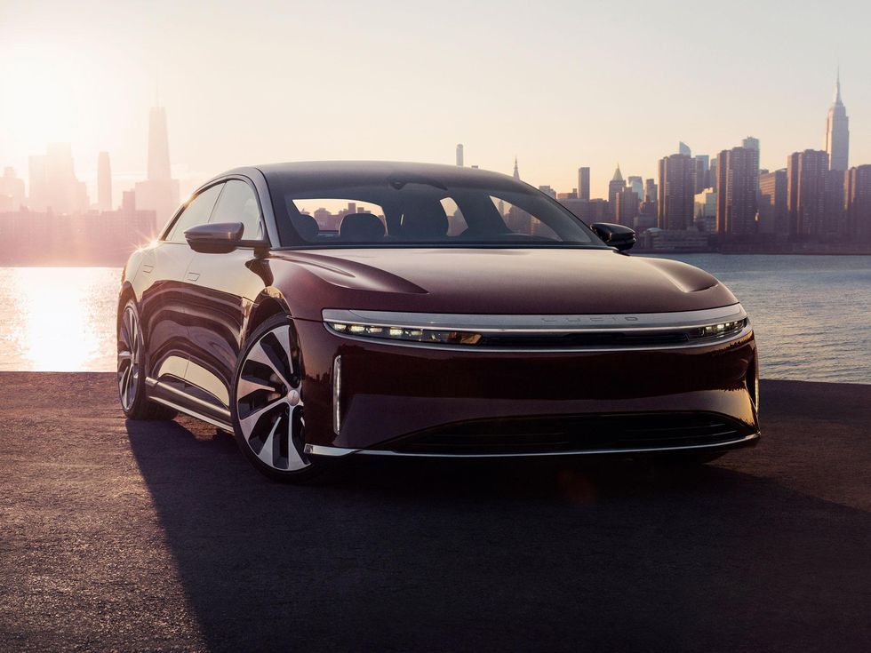 The Lucid Air electric vehicle against a city backdrop.