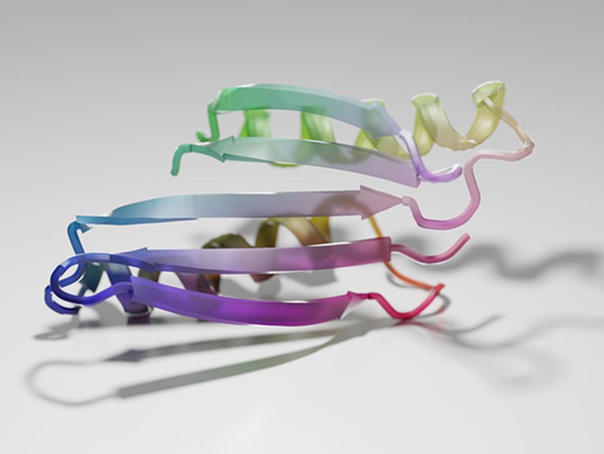 This computer rendering of multicolored ribbons that represent the shape of a twisted protein structure ithat's one of hundreds dreamed up by a machine-learning algorithm.