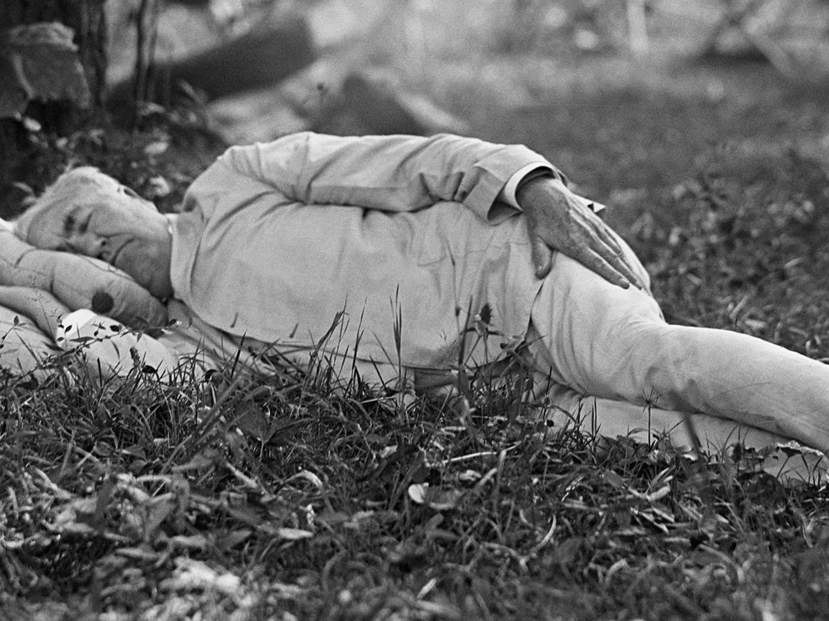 Thomas Edison taking a nap outdoors