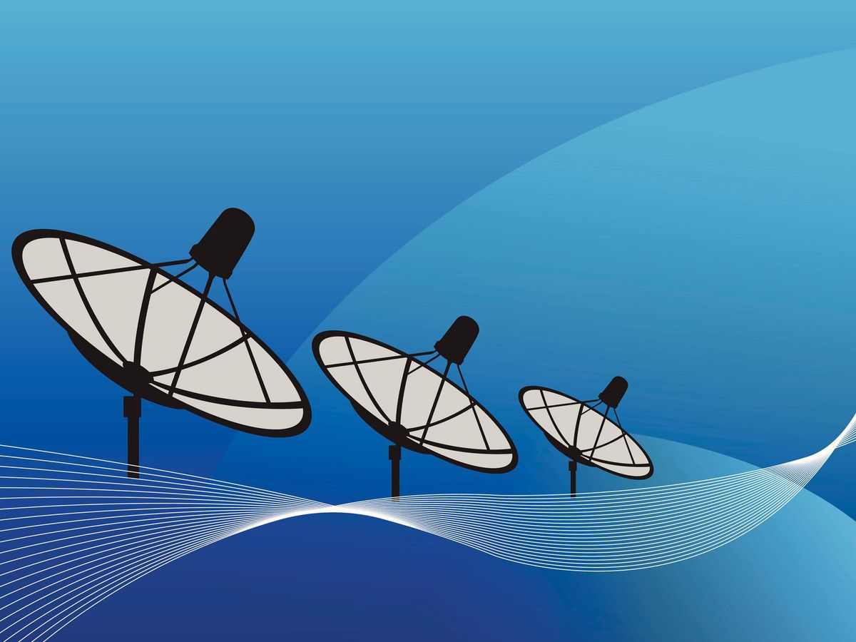 three large satellite antennaes against a blue background