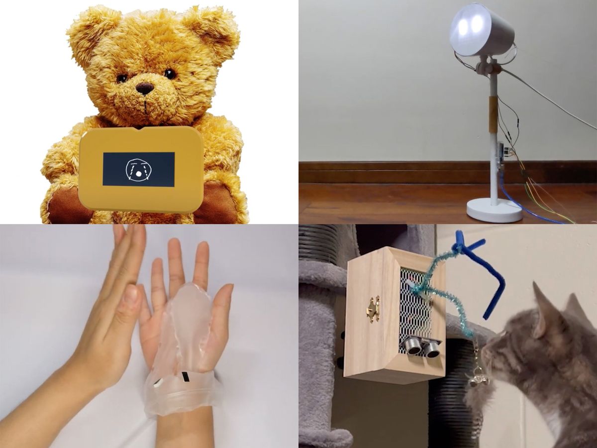 Top left, a stuffed bear with a screen attached to its stomach. Top right, a lamp with two bright spots that resemble eyes. Bottom left, a pair of human hands with a clear material on them. Bottom right, a cat looking at a wooden box with pipe cleaners attached to it.