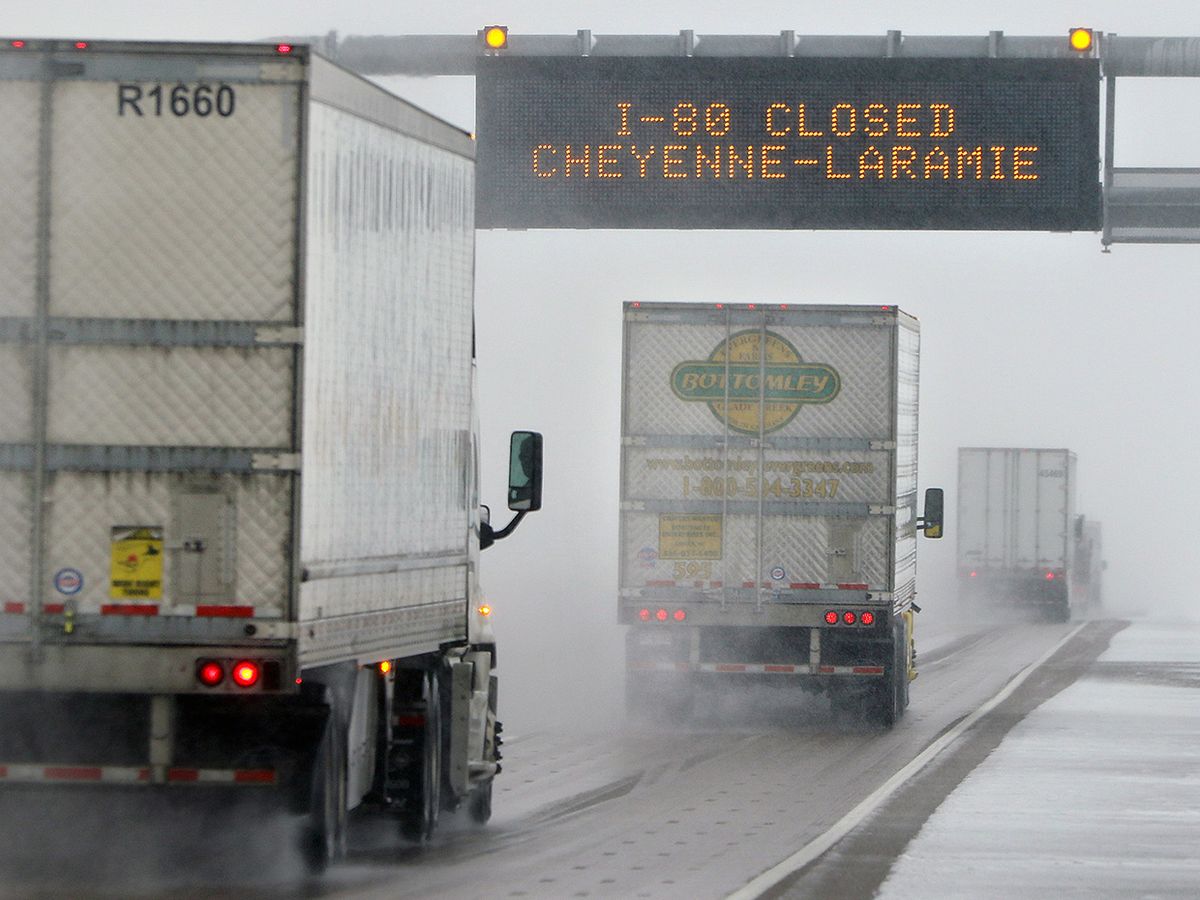 Truck drivers head toward Cheyenne, Wyo., in limited visibility at mile marker 373 on Interstate 80