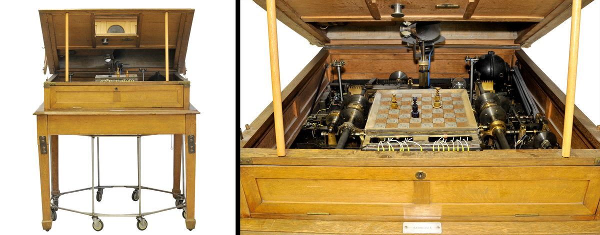 Two photos show a wooden box propped open that is part of a wheeled table, seen in full on the left, and in close-up on the right, including a chess board with three pieces and other electromechanical elements inside.
