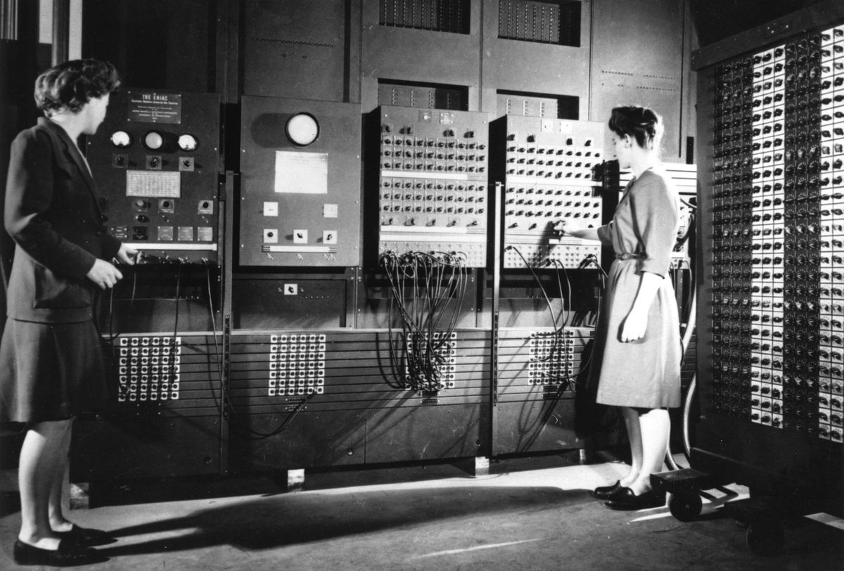 two-women-programmers-preparing-a-computer-to-be-demonstrated