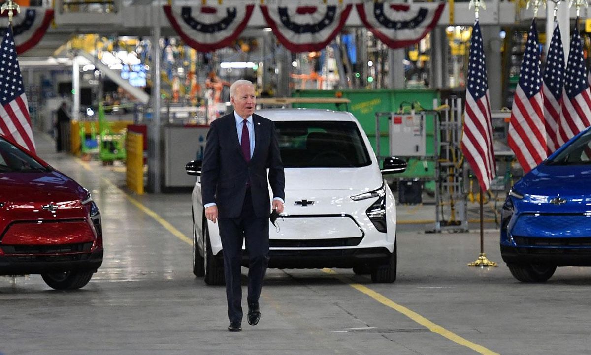 US President Joe Biden walks near Chevy vehicles as he arrives to deliver remarks during a visit to the General Motors Factory ZERO electric vehicle assembly plant in Detroit, Michigan on November 17, 2021.