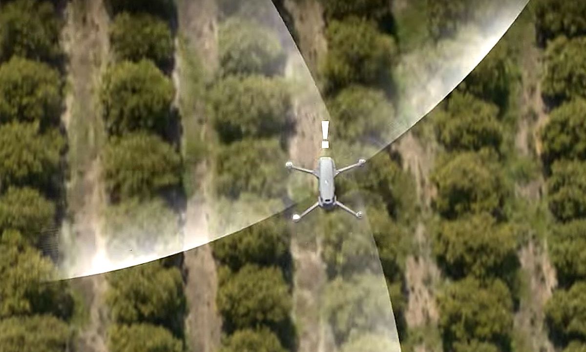 Video still of a DJI drone sensing nearby aircraft and exhibiting a warning.