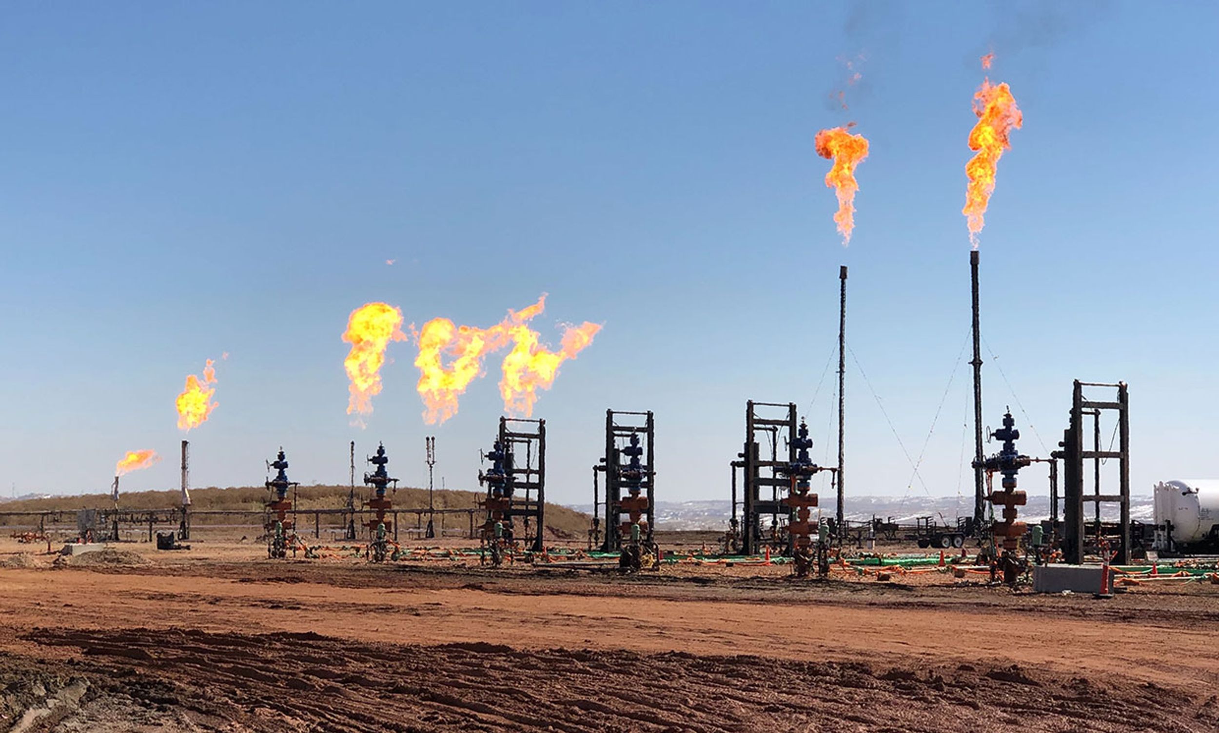 When oil companies cannot transport the associated natural gas produced from oil wells, they burn the gas in a flare with no beneficial use.
