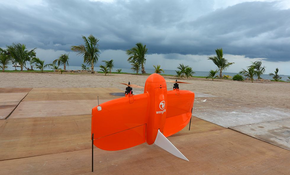 Wingtra\u2019s bright orange drone ready to fly in all weather conditions.