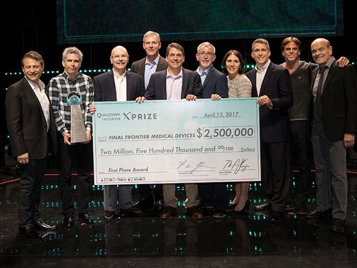 Winners of Qualcomm Tricorder XPRIZE hold check