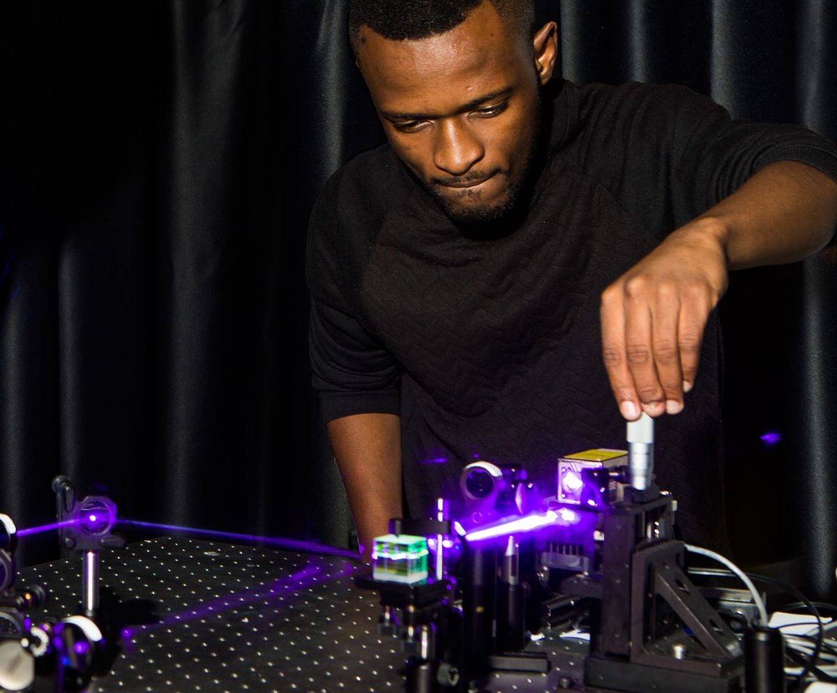 Wits Ph.D. student Isaac Nape -- one of the two lead Ph.D. students on the project -- aligns a quantum entanglement experiment.
