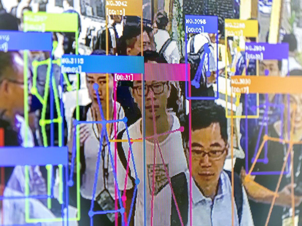 World Artificial Intelligence Conference in Shanghai attendees viewing themselves as recognized by facial-recognition technology.
